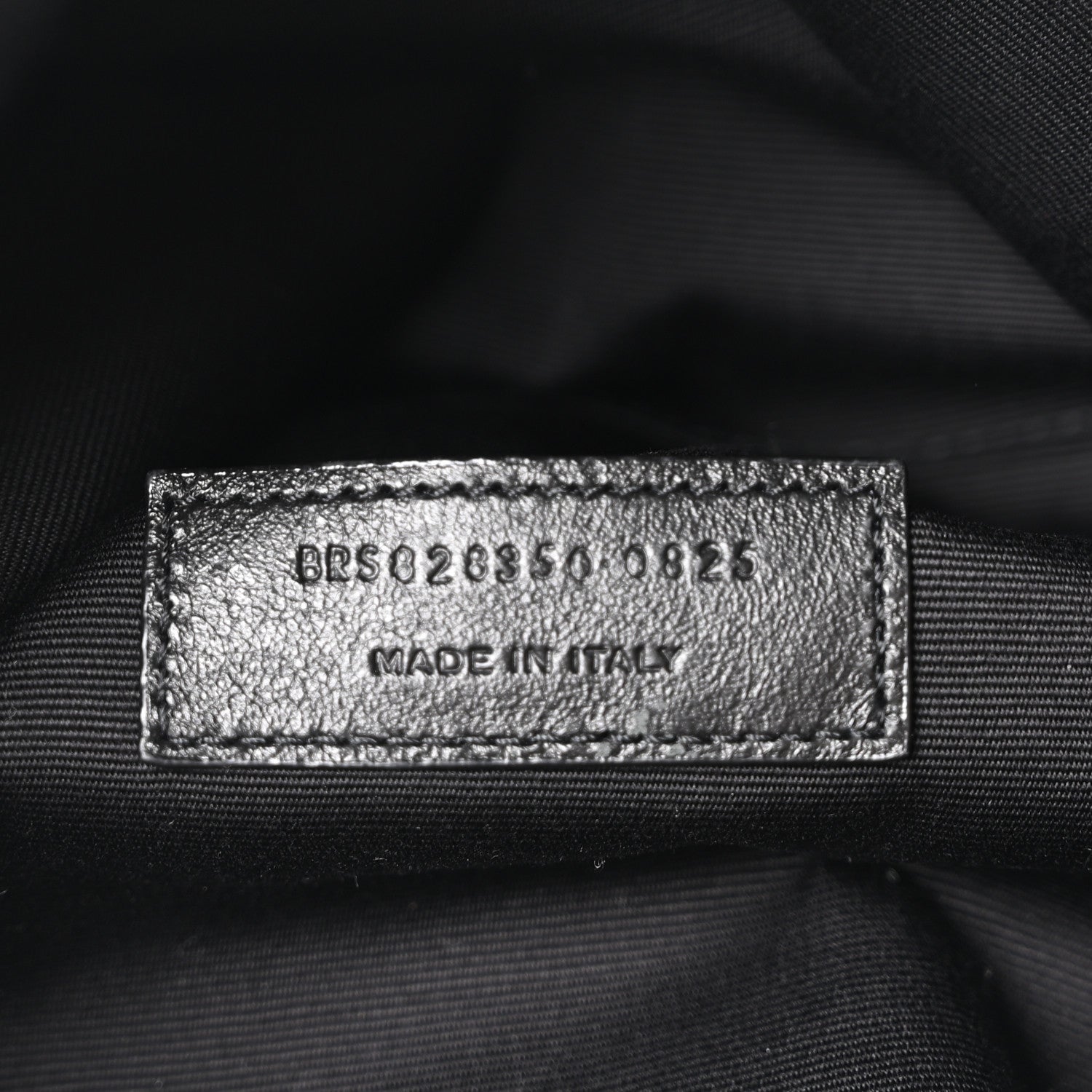 Leather interior label with style code and Made in Italy, close-up