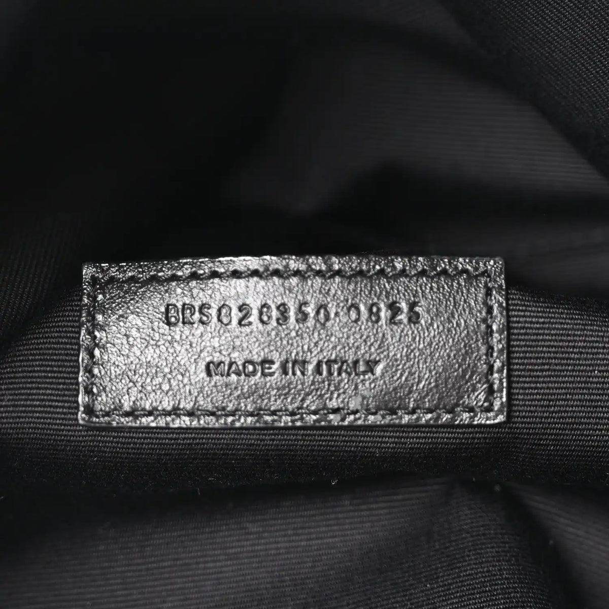 Leather interior label with style code and Made in Italy, close-up