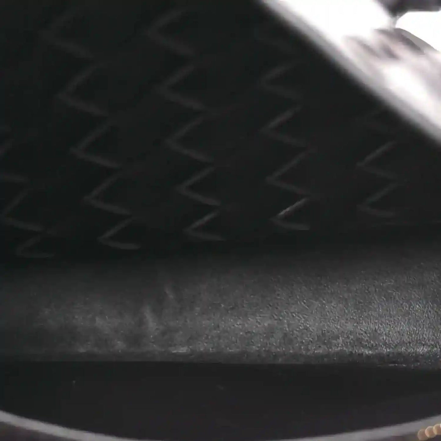 Intrecciato leather bag interior lining with zipper track and seam