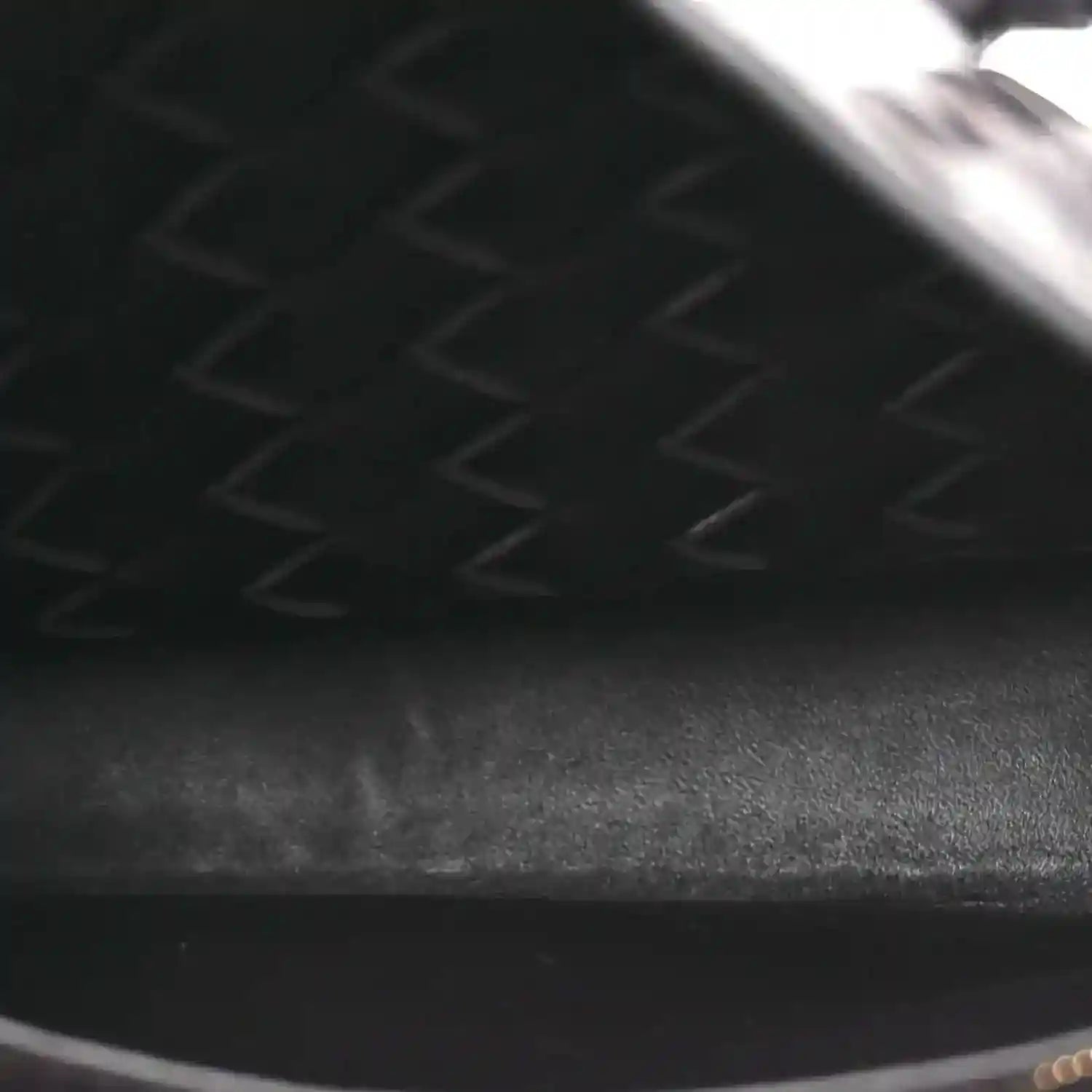 Intrecciato leather bag interior lining with zipper track and seam