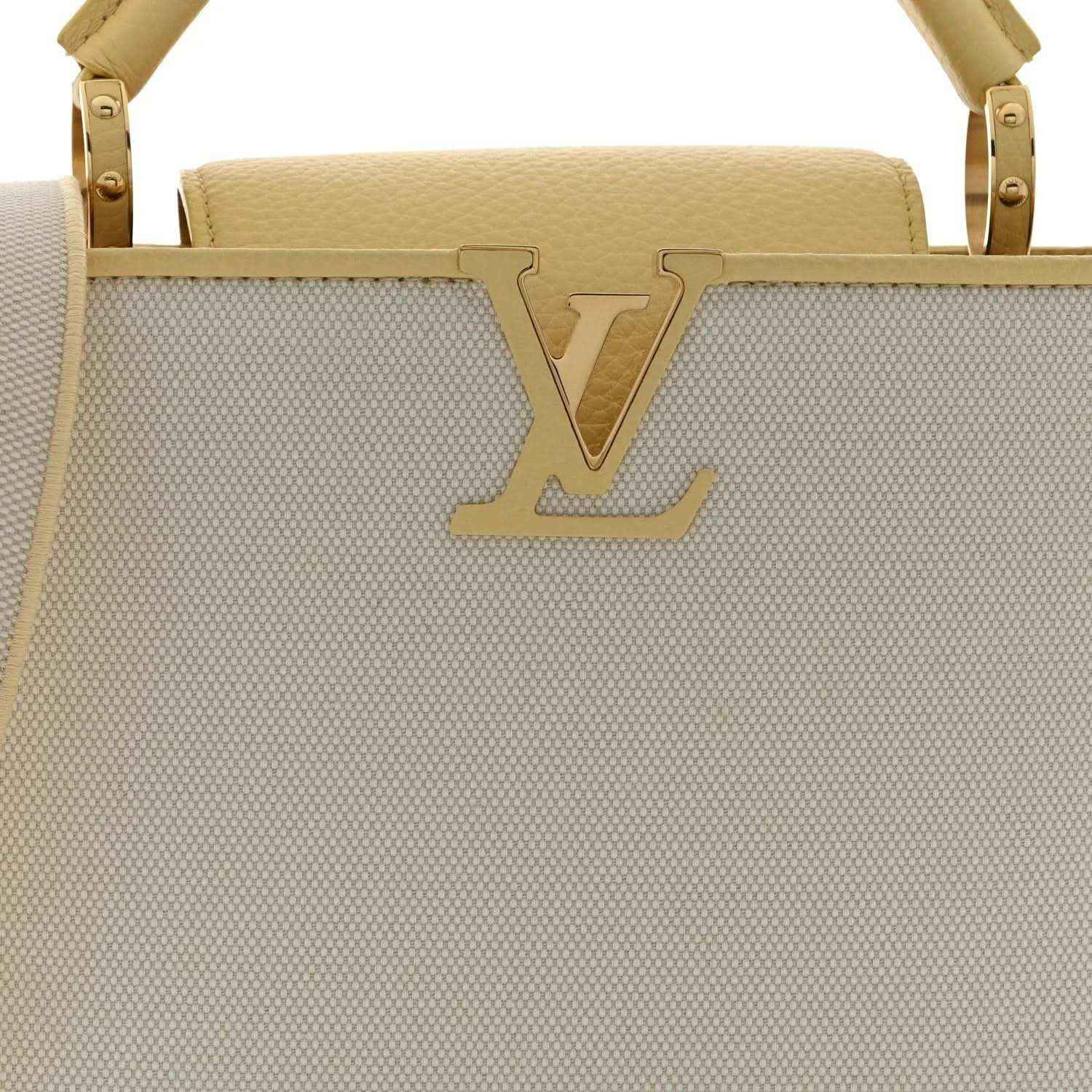 Louis Vuitton Capucines BB handbag front view with large LV emblem on light canvas