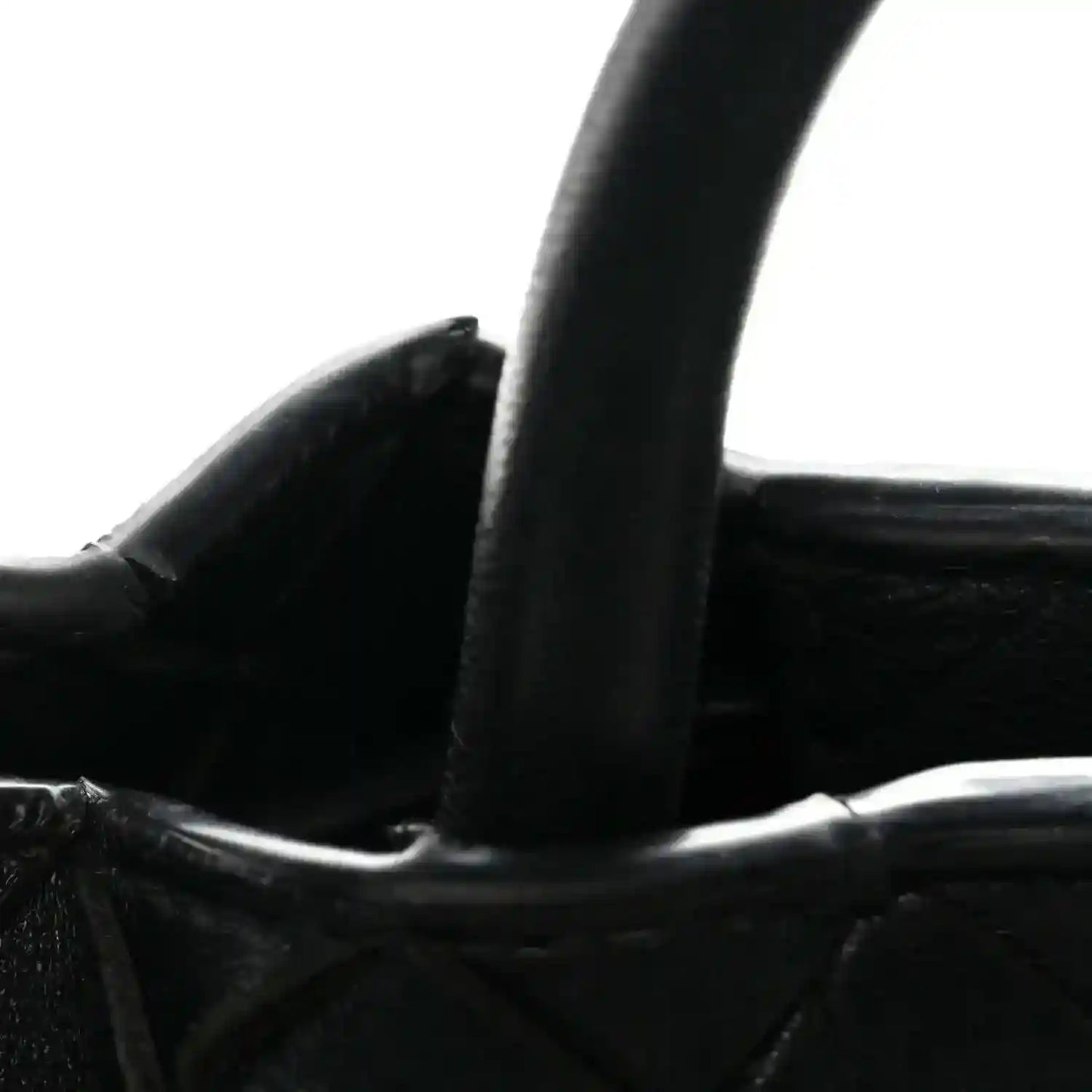 Black leather shoulder bag strap and braided top trim with interior view