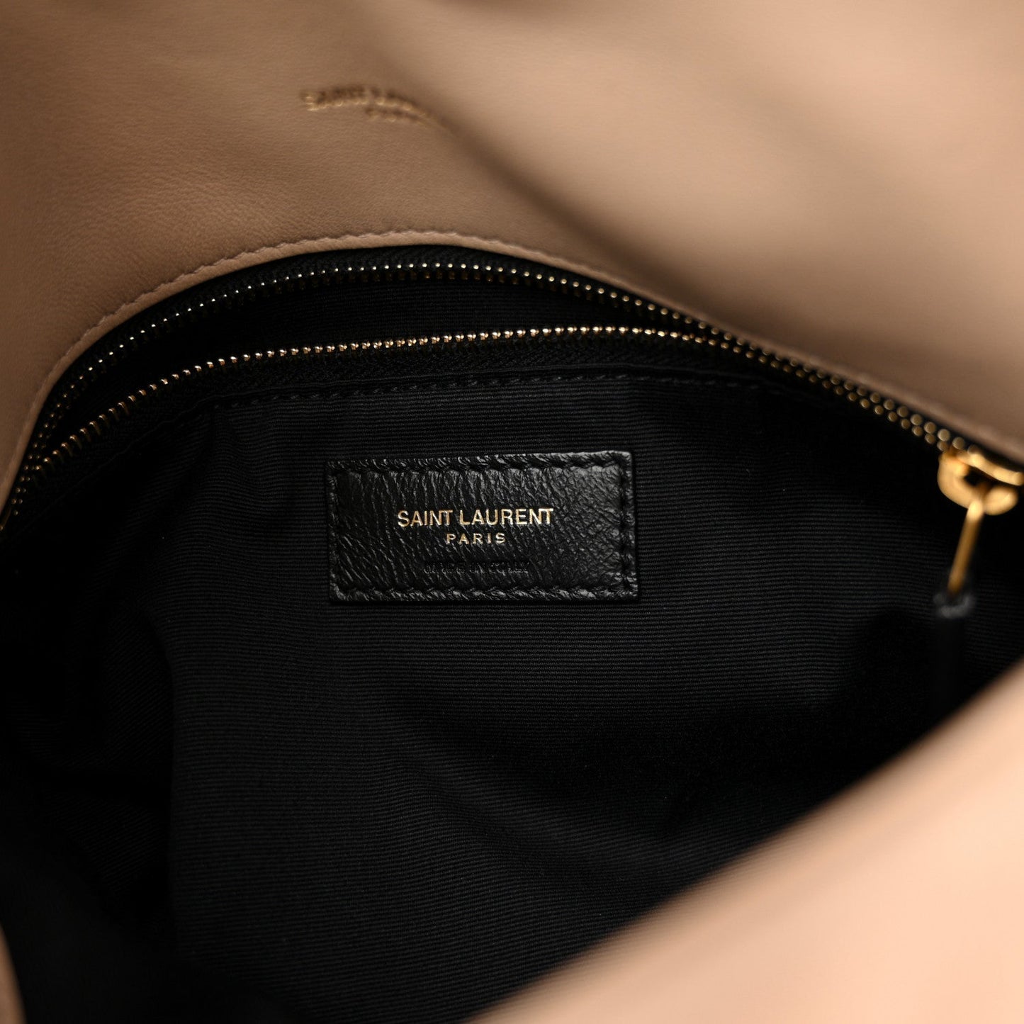 Saint Laurent interior label on black lining with zip closure, gold-tone zipper
