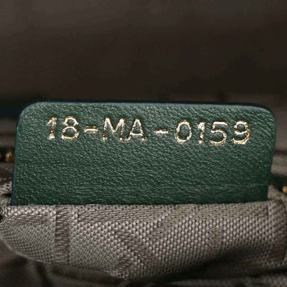 Green leather label with serial code 18-MA-0159