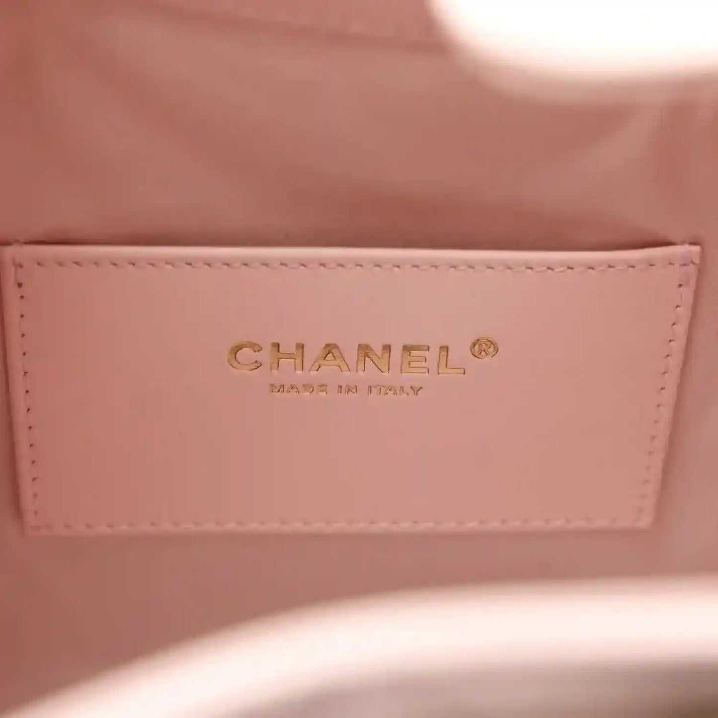 Chanel light pink interior label with CHANEL logo on stitched panel