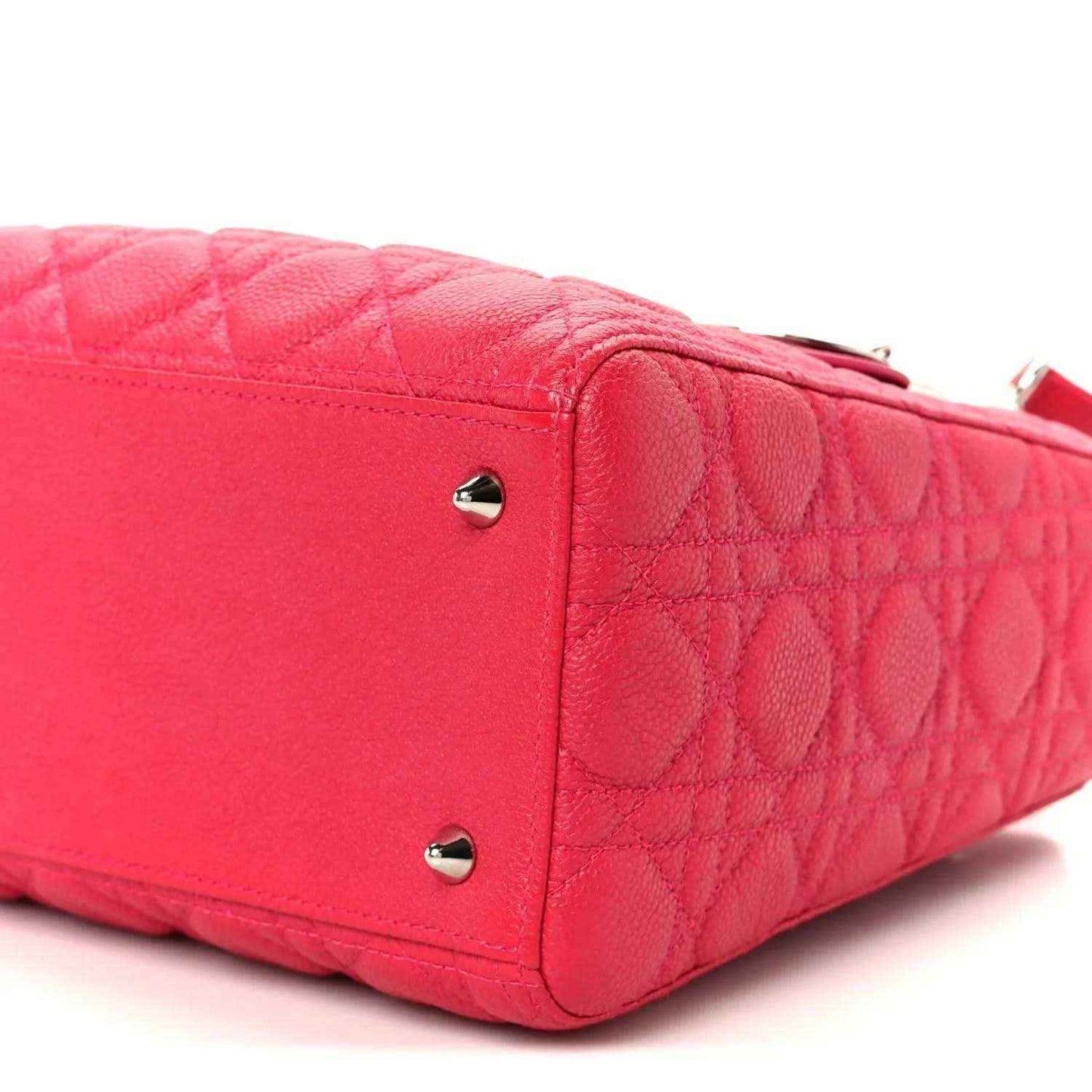Pink quilted handbag side panel with two silver studs and leather trim