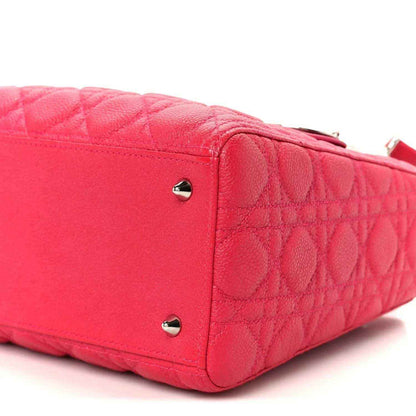 Pink quilted handbag side panel with two silver studs and leather trim
