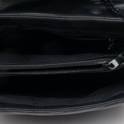 Black satchel interior with zip closure and metal zipper pull