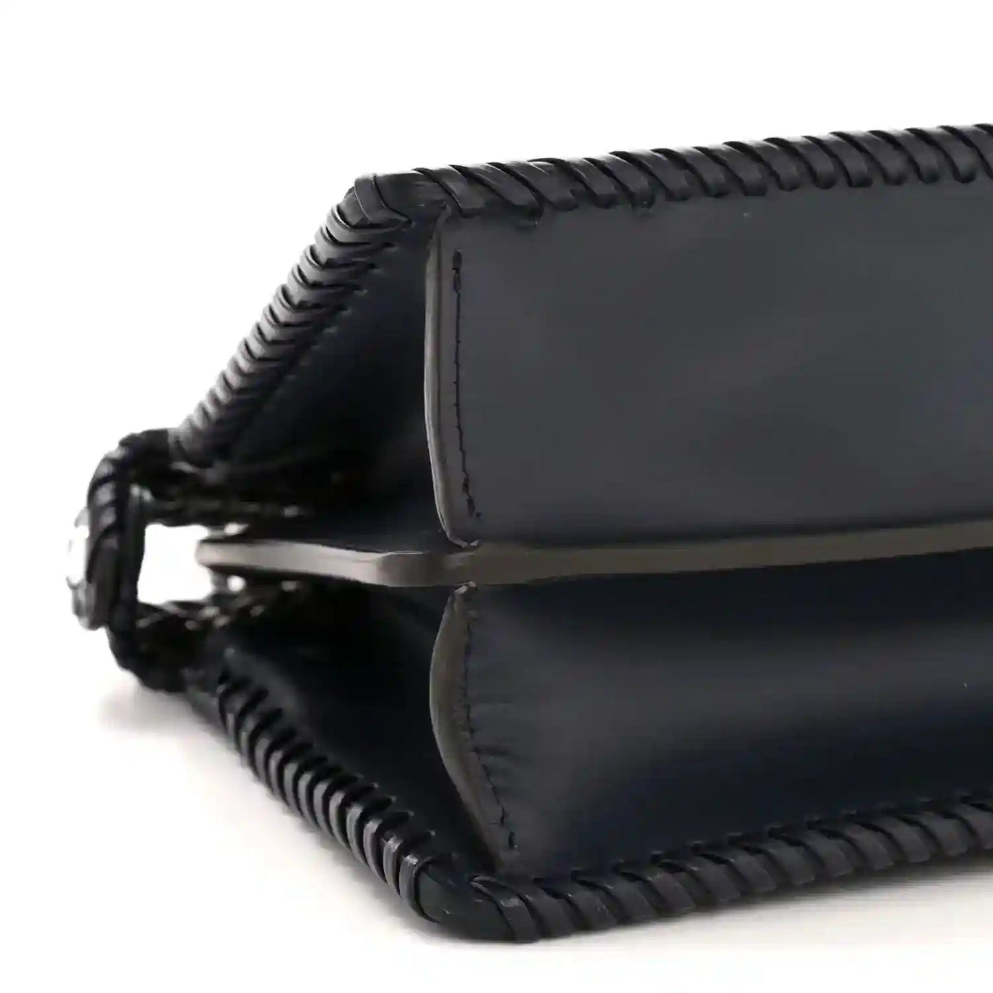 Midnight blue leather satchel bottom corner with braided edge and stitched trim