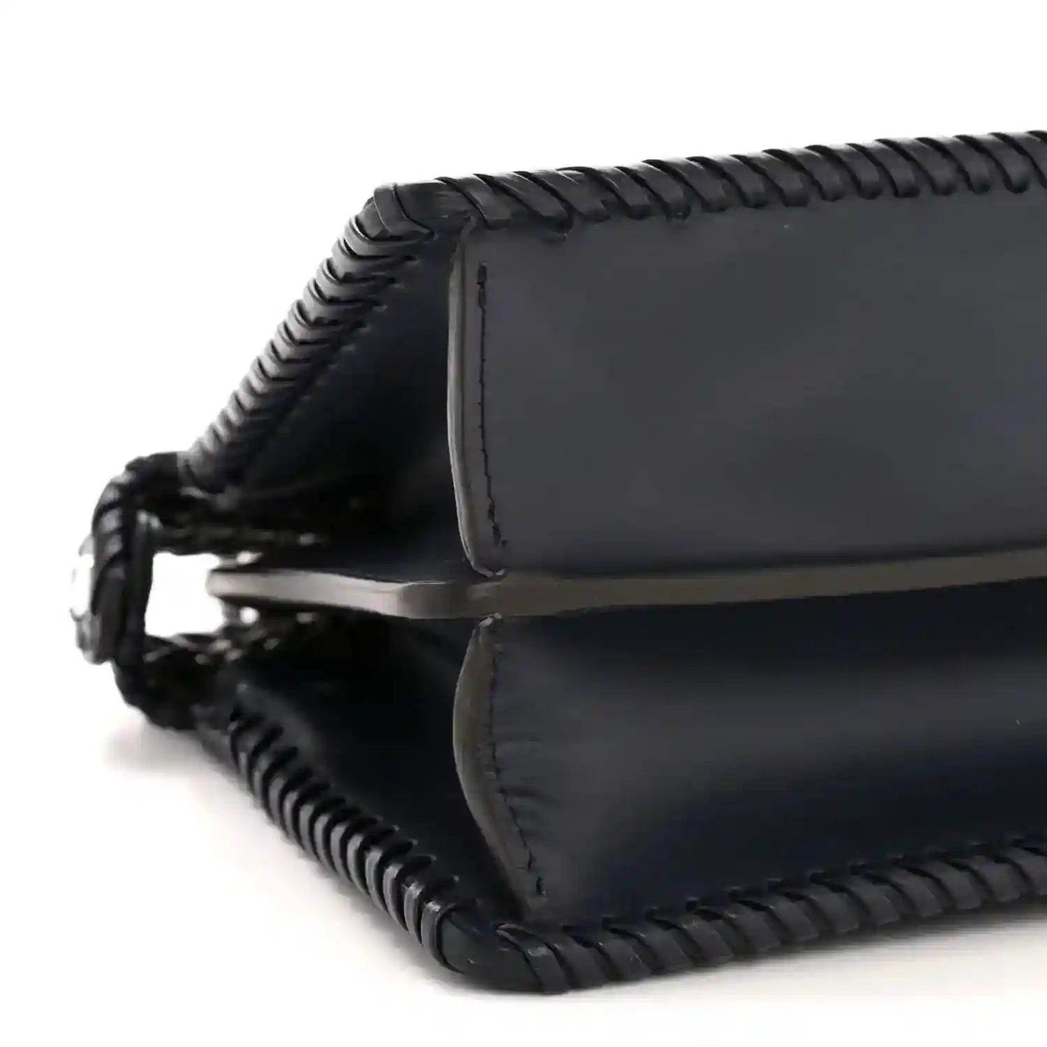 Midnight blue leather satchel bottom corner with braided edge and stitched trim