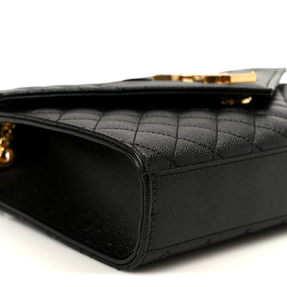 Black quilted satchel with leather trim and gold-toned hardware corner