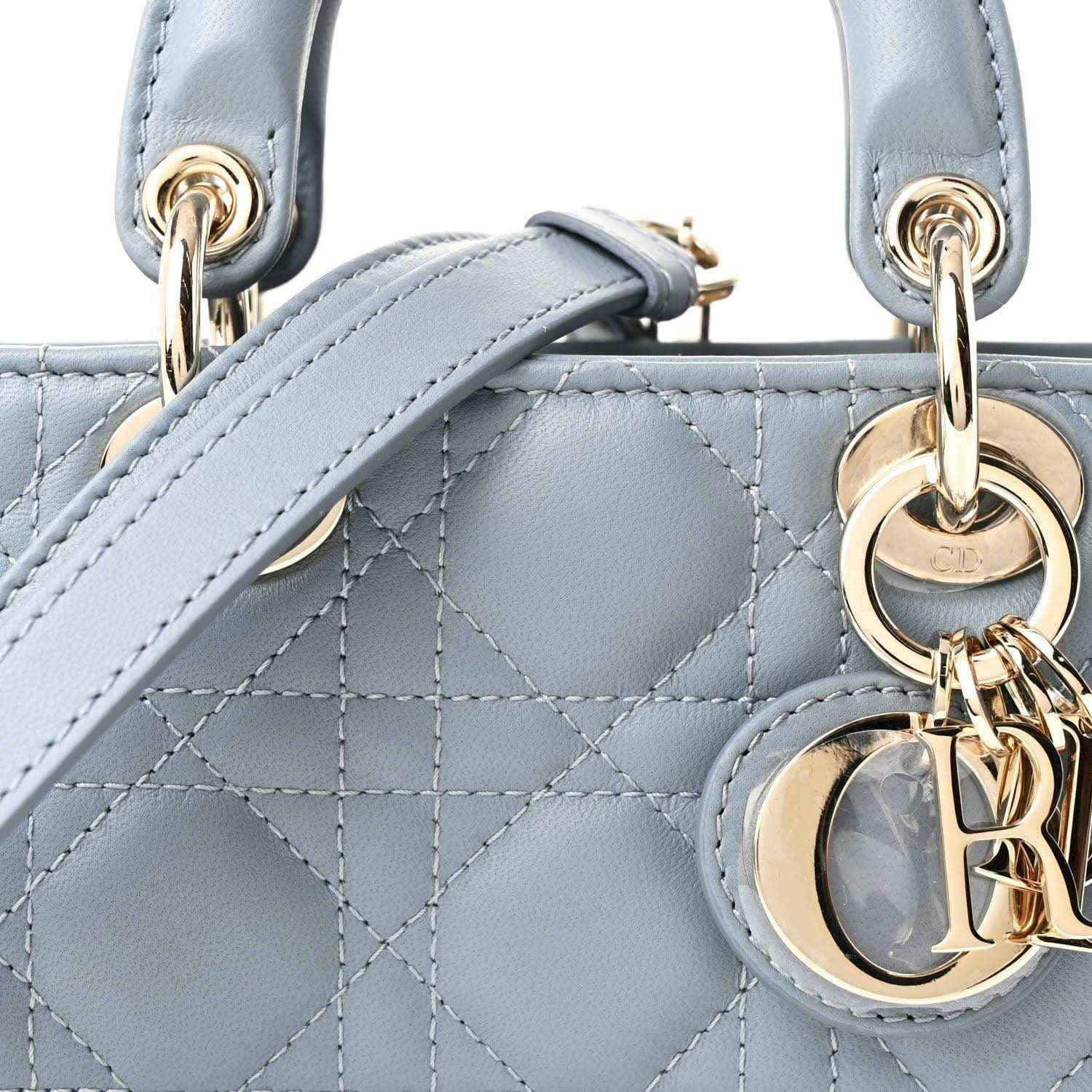 Micro Lady D-Joy bag top detail in light blue with gold rings and logo charm