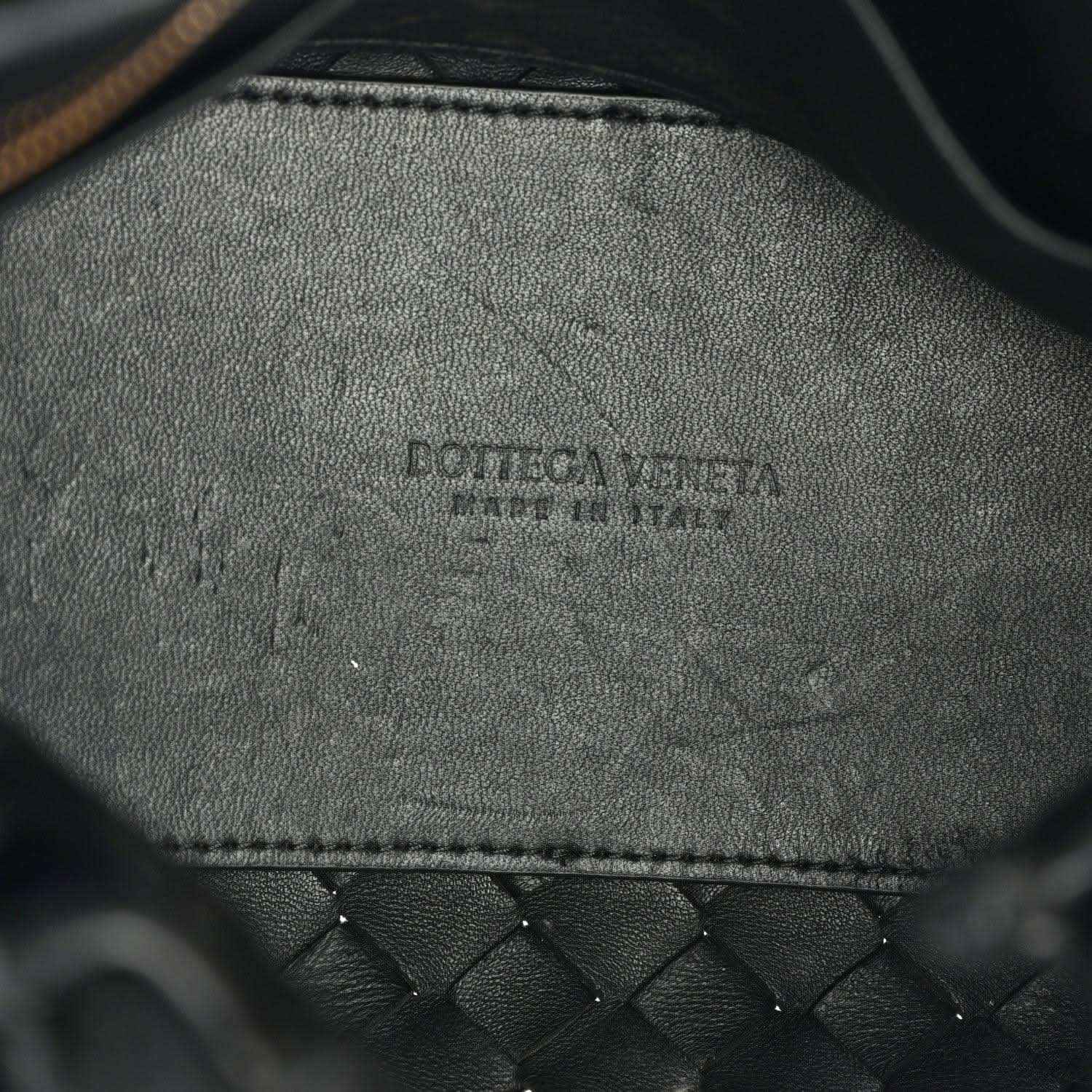 Black leather interior with embossed brand logo and stitched edge