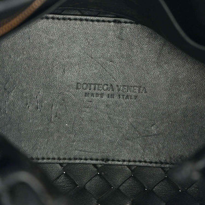 Black leather interior with embossed brand logo and stitched edge