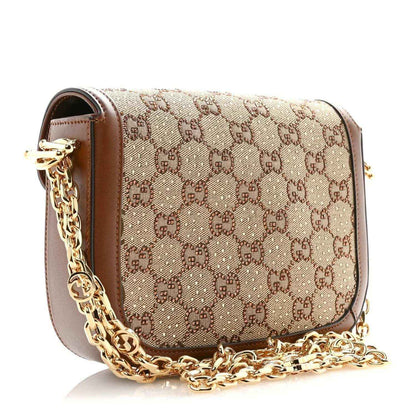 Mini shoulder bag with GG monogram canvas, brown leather edging, and gold-tone chain strap