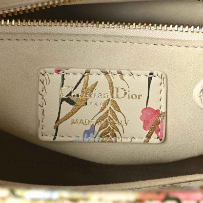 Logo patch on tote lining reading Dior, with gold-tone zipper edge
