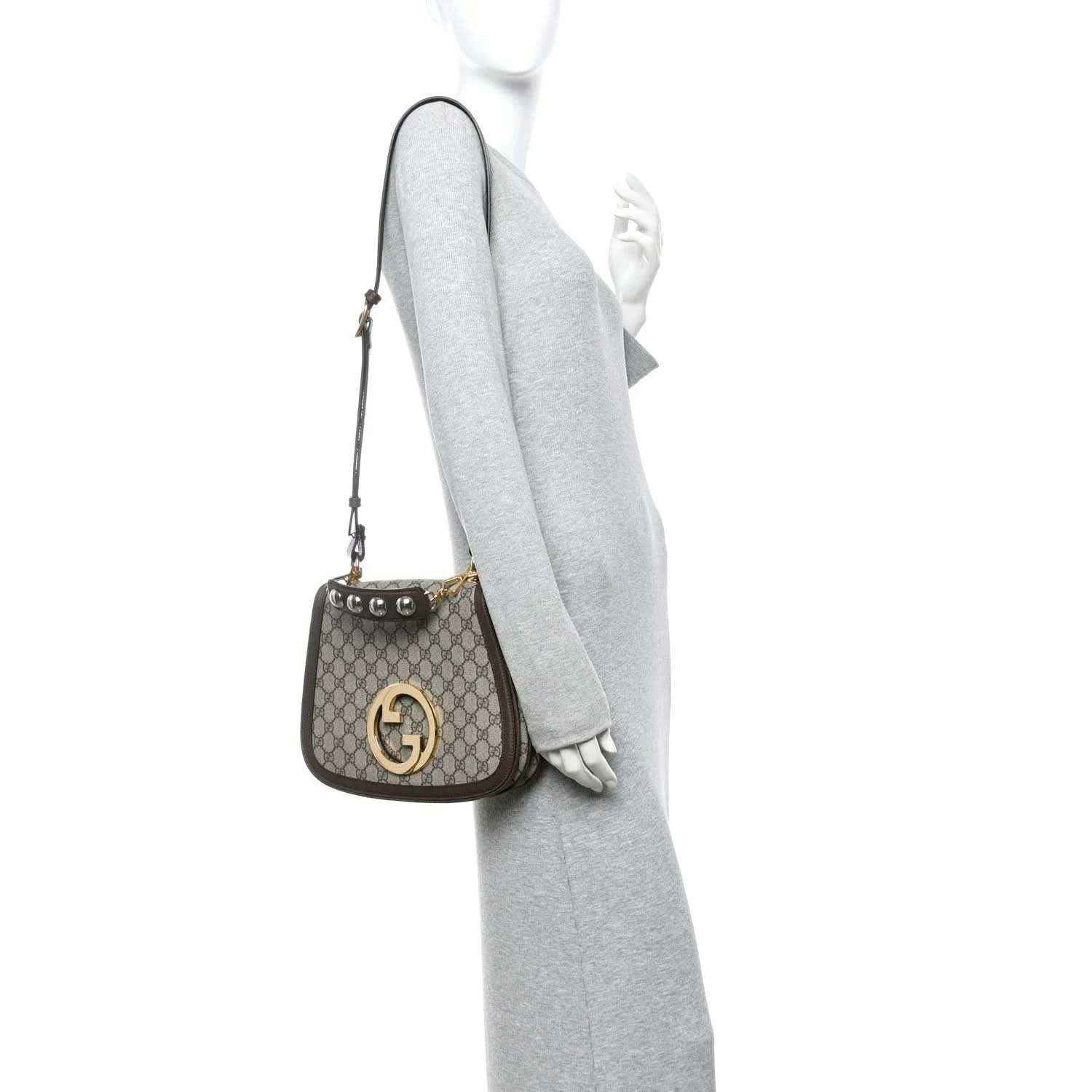 Medium GG Supreme monogram shoulder bag side view with gold-tone logo hardware