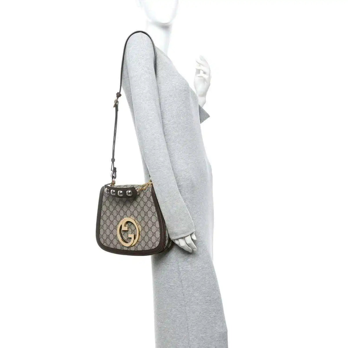 Medium GG Supreme monogram shoulder bag side view with gold-tone logo hardware