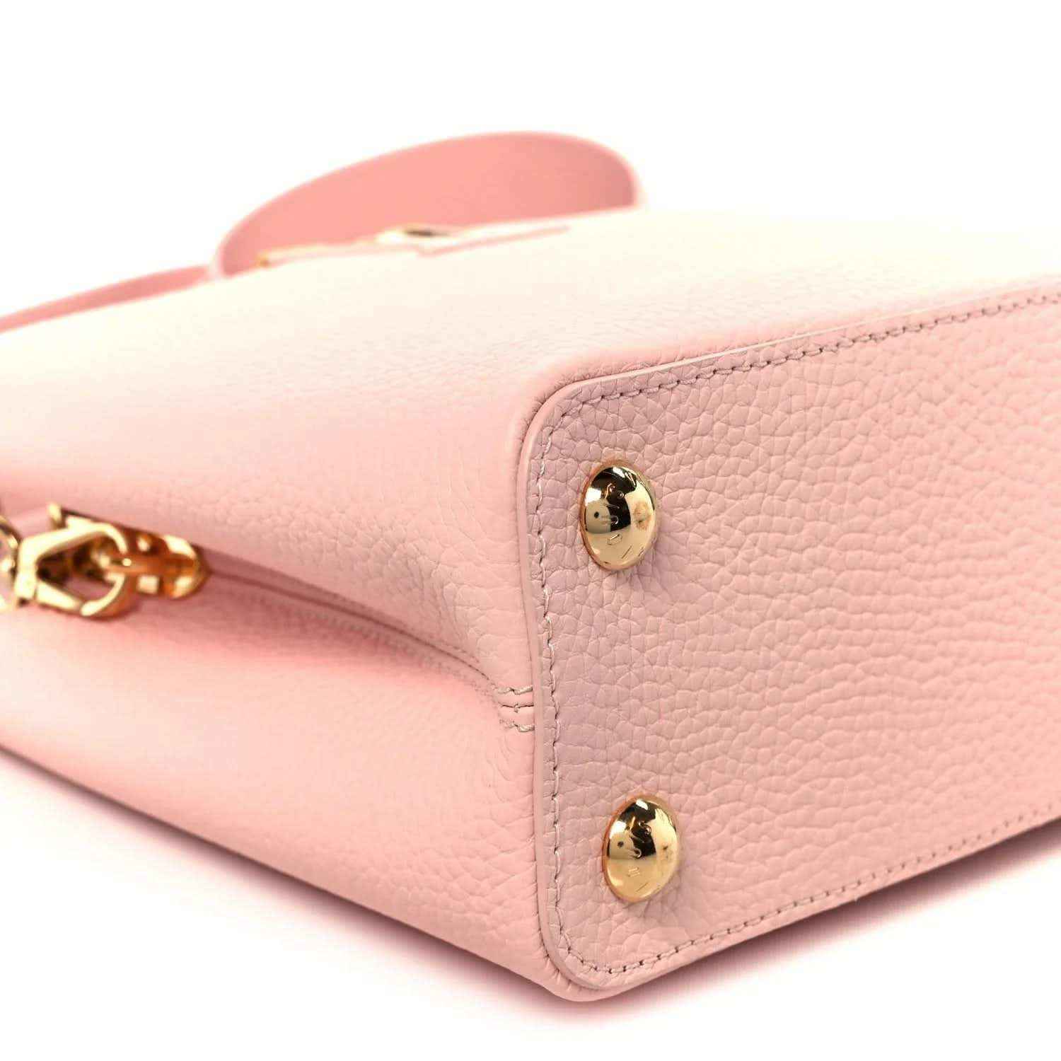 Louis Vuitton Capucines BB shoulder bag corner detail with two gold snap buttons