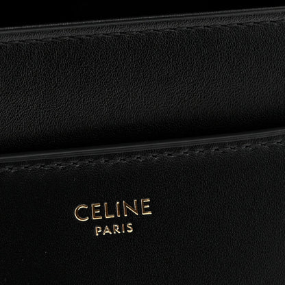 Black leather with CELINE PARIS embossed branding and subtle stitching detail