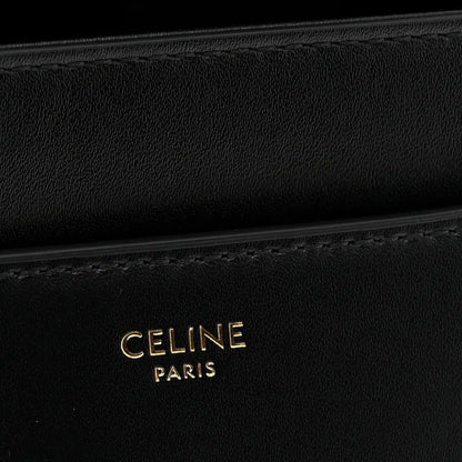 Black leather with CELINE PARIS embossed branding and subtle stitching detail