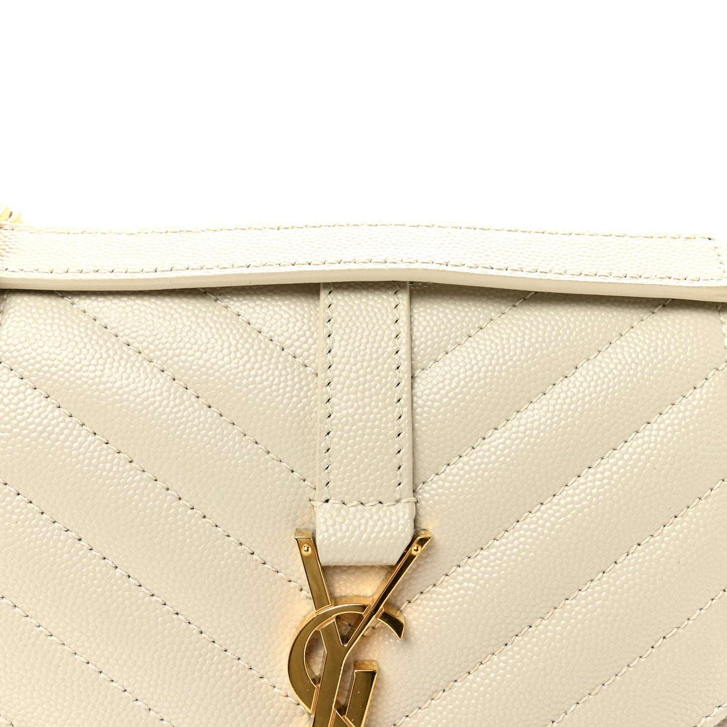 Cream quilted satchel flap with gold monogram latch hardware