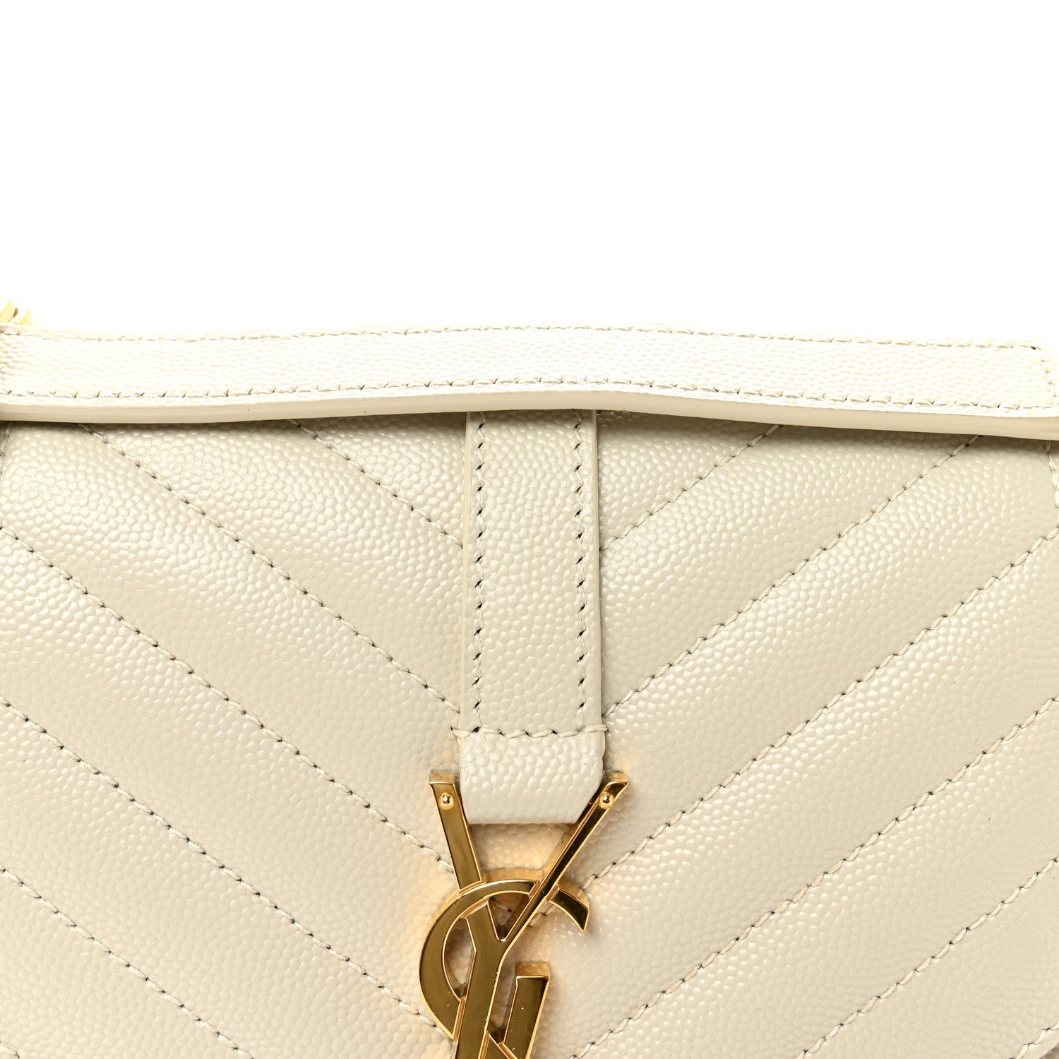 Cream quilted satchel flap with gold monogram latch hardware