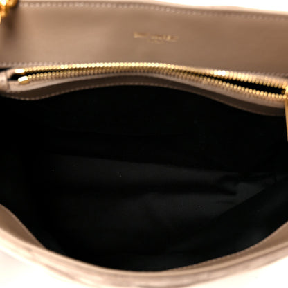 Satchel interior lining with visible gold zipper trim