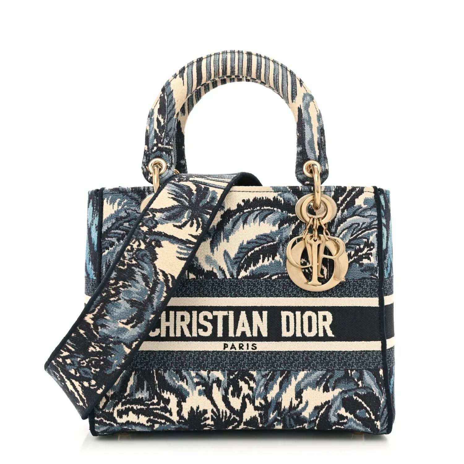 Medium tote bag with blue palm toile print, navy trim, top handles, and gold Dior charm