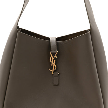 Saint Laurent hobo bag top opening in light musk with YSL logo hardware charm