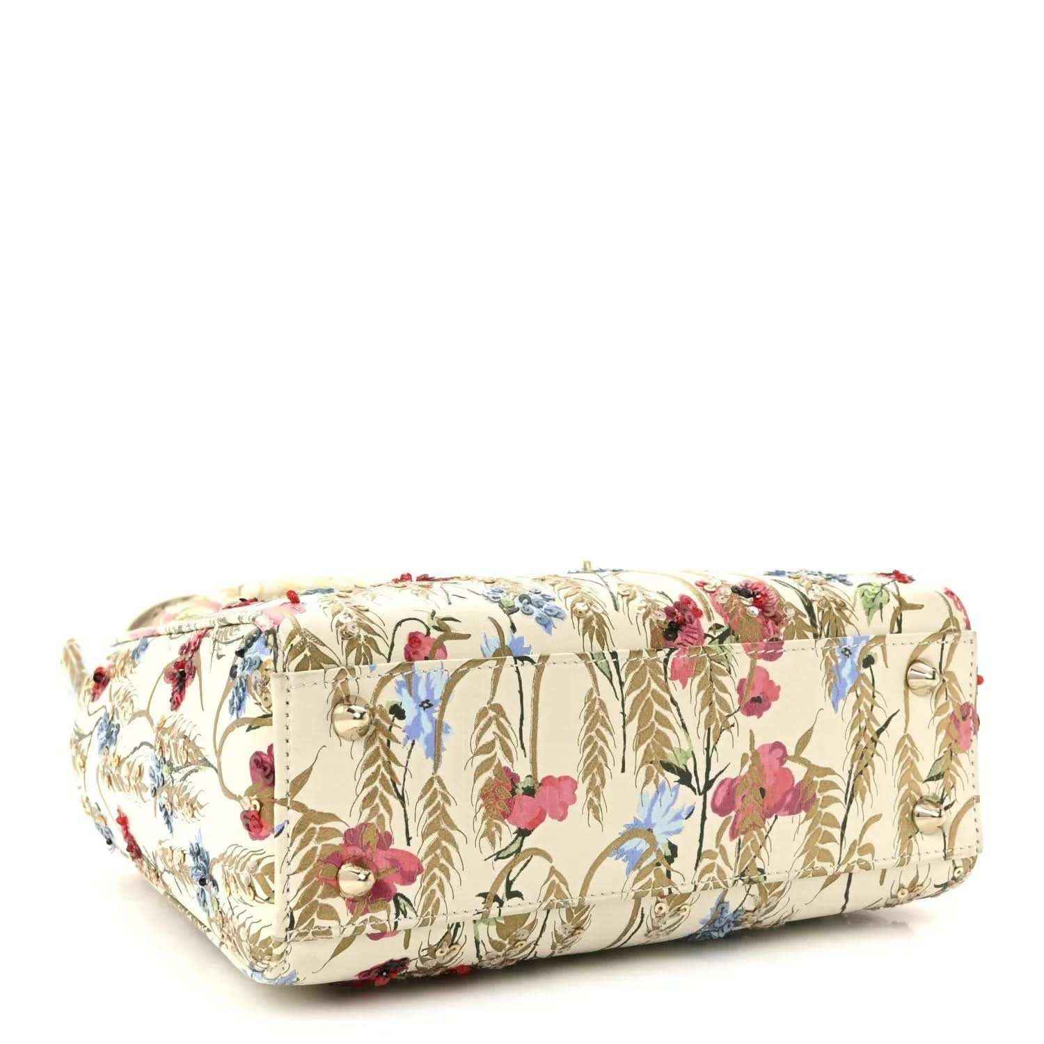 Embroidered floral tote bag with structured base and gold-tone accents