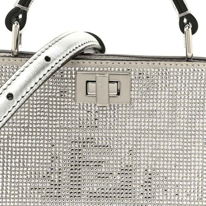 Crystal-embellished front panel with square logo turn-lock clasp, silver tone hardware.