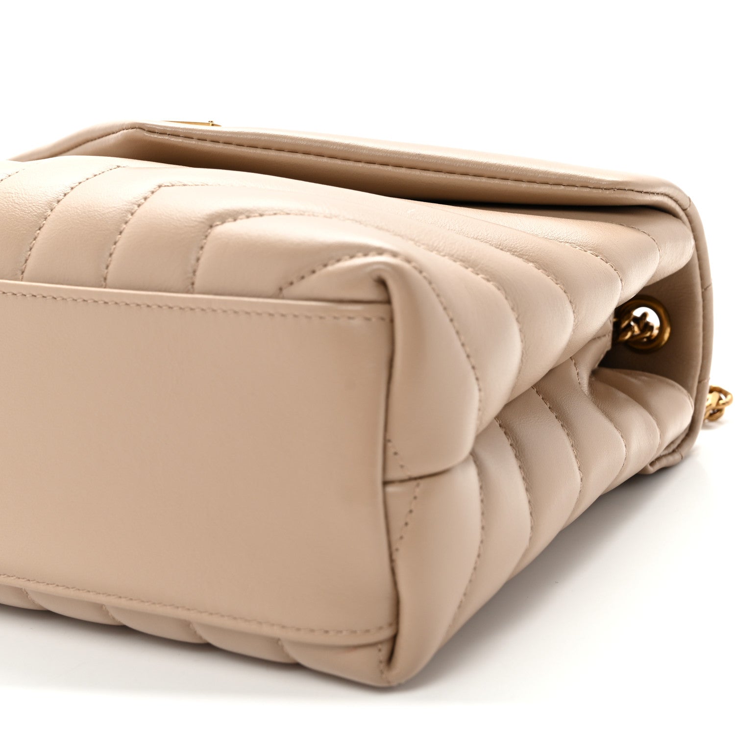 Quilted dark beige satchel side with snap button and gold hardware