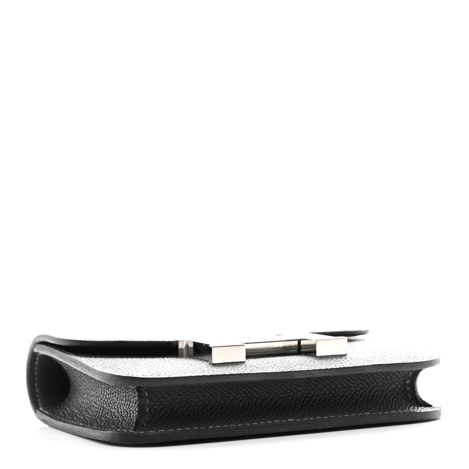 Constance slim wallet profile view in dark textured leather with H clasp hardware