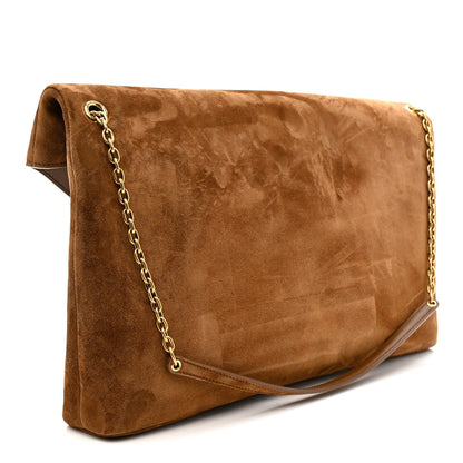 Caramel suede flap pouch on chain bag with gold chain strap, angled side view