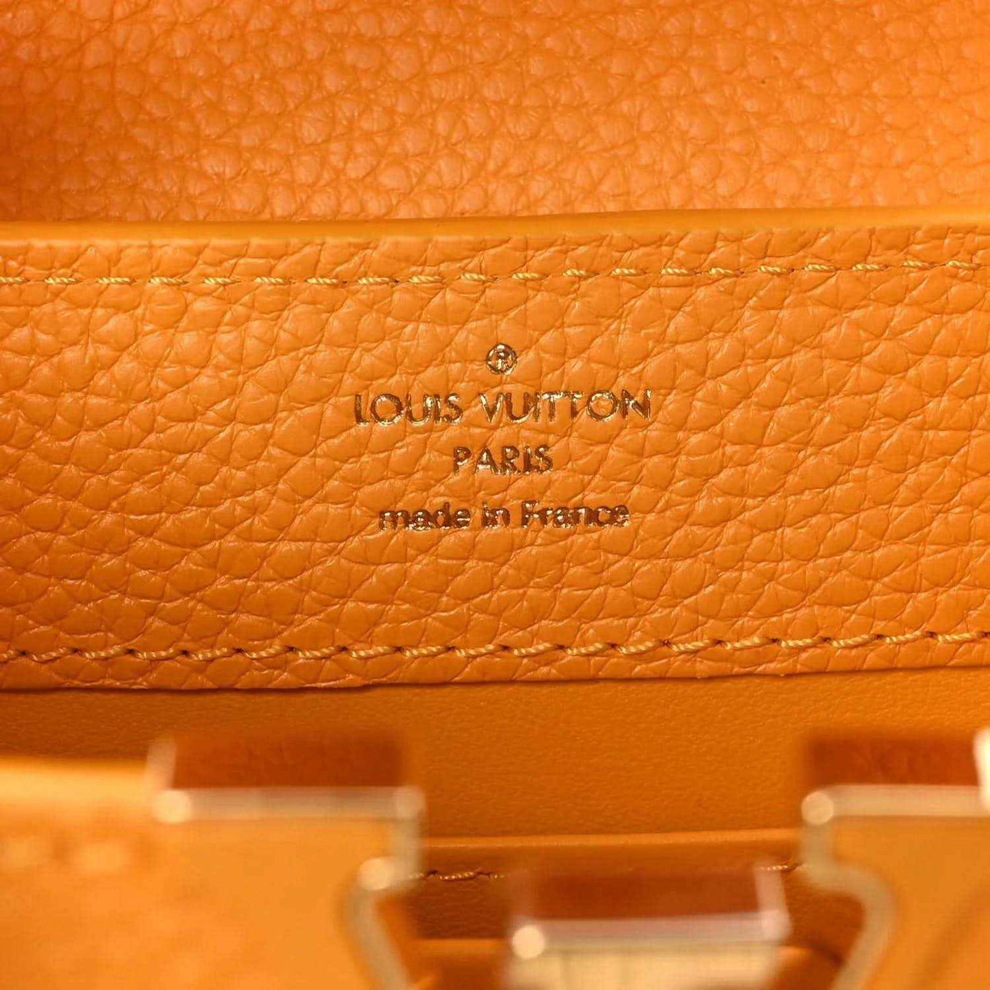 Louis Vuitton leather handbag in yellow with embossed 'Louis Vuitton Paris' on lining