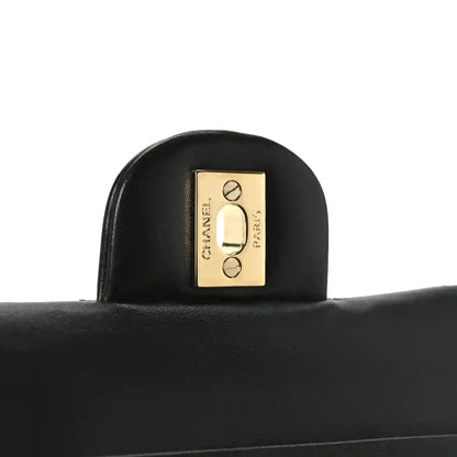 Chanel black leather handbag interior plaque with gold “CHANEL” logo