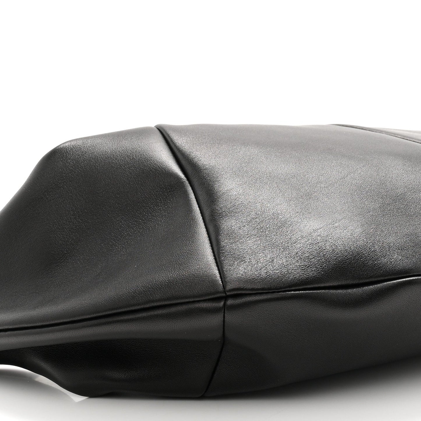 Black lambskin hobo bag panel and crease detail near the top seam