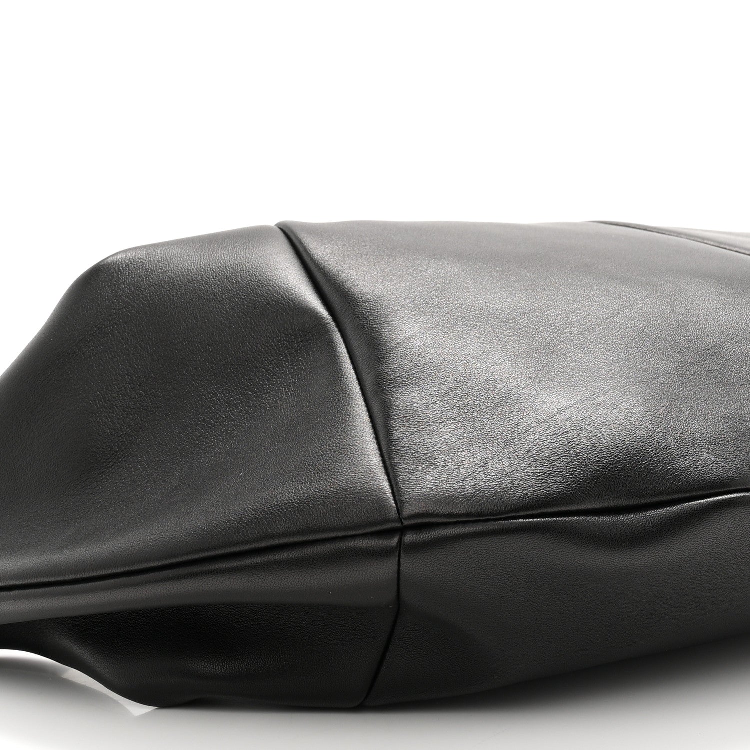 Black lambskin hobo bag panel and crease detail near the top seam