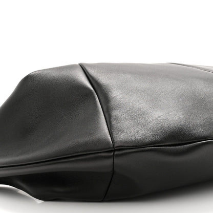 Black lambskin hobo bag panel and crease detail near the top seam