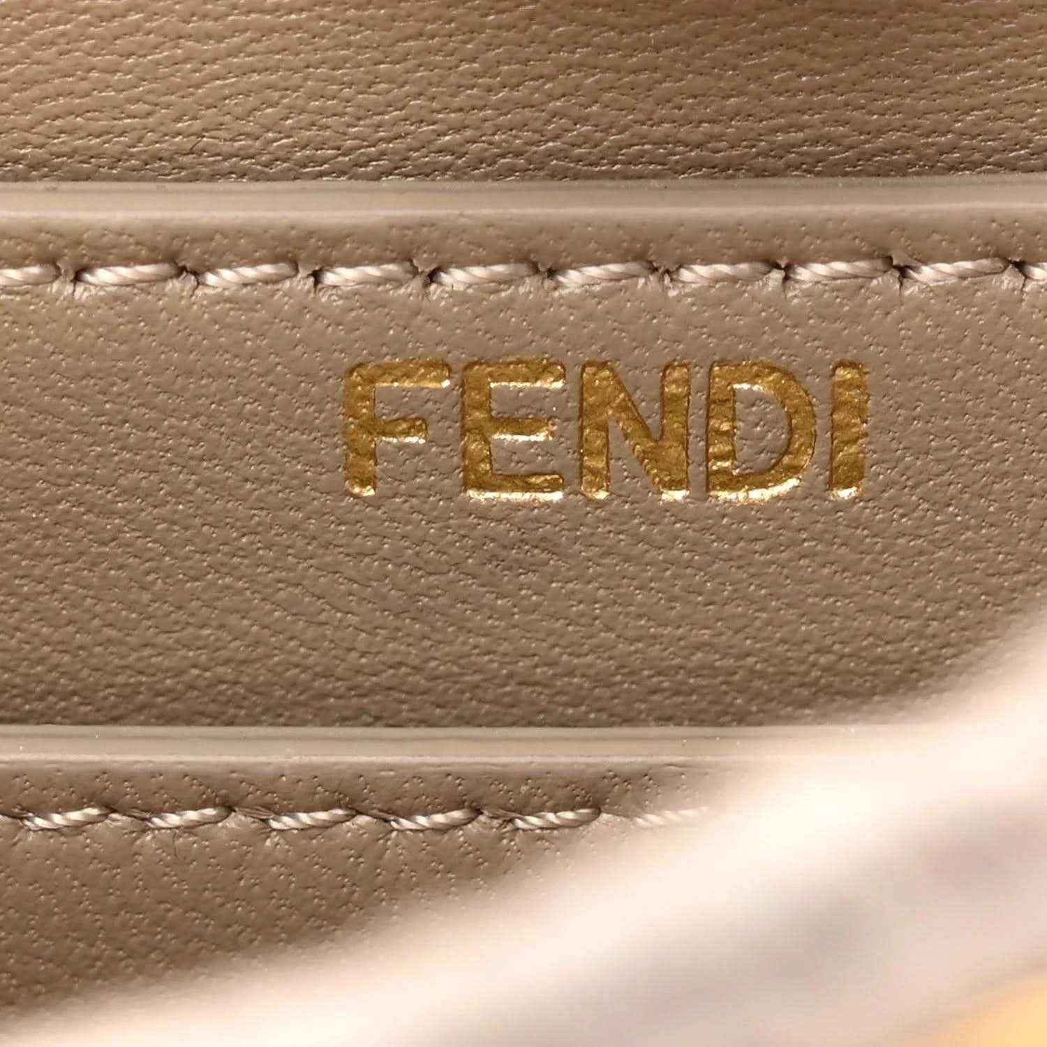FENDI logo on light gray leather satchel lining