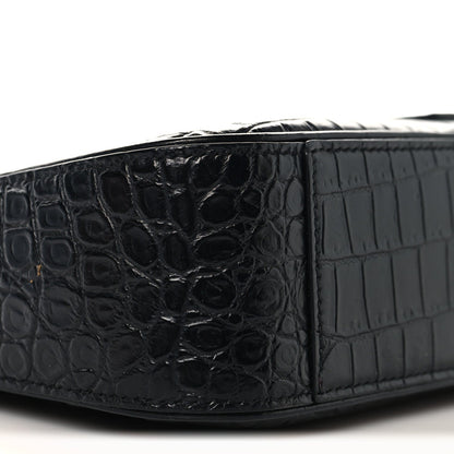 Black crocodile-embossed hobo shoulder bag side panel close-up