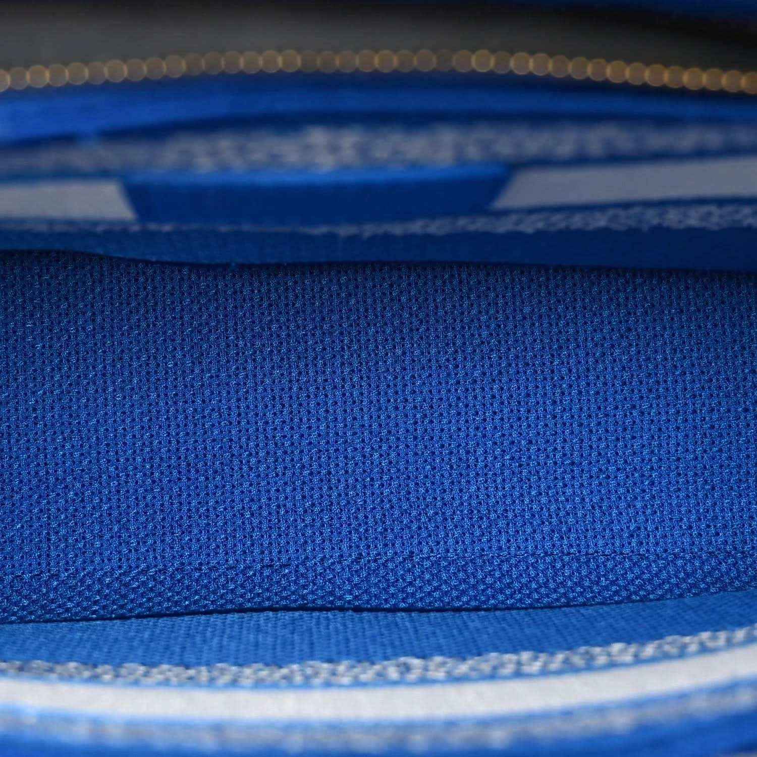 Blue woven fabric panel with white trim detail on the Christian Dior tote bag
