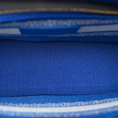Blue woven fabric panel with white trim detail on the Christian Dior tote bag