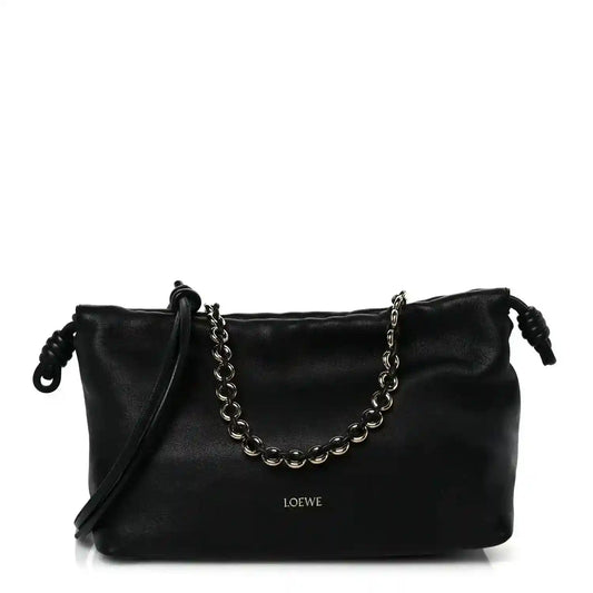 Black leather Flamenco-style clutch with chain strap and short shoulder drop handles.