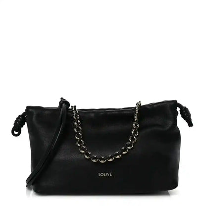 Black leather Flamenco-style clutch with chain strap and short shoulder drop handles.
