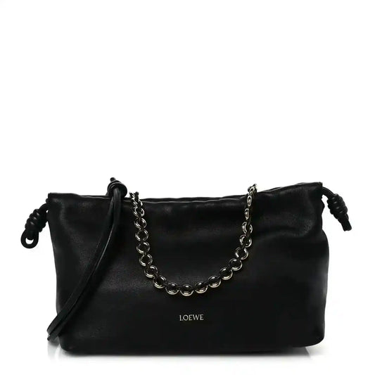 Black leather Flamenco-style clutch with chain strap and short shoulder drop handles.