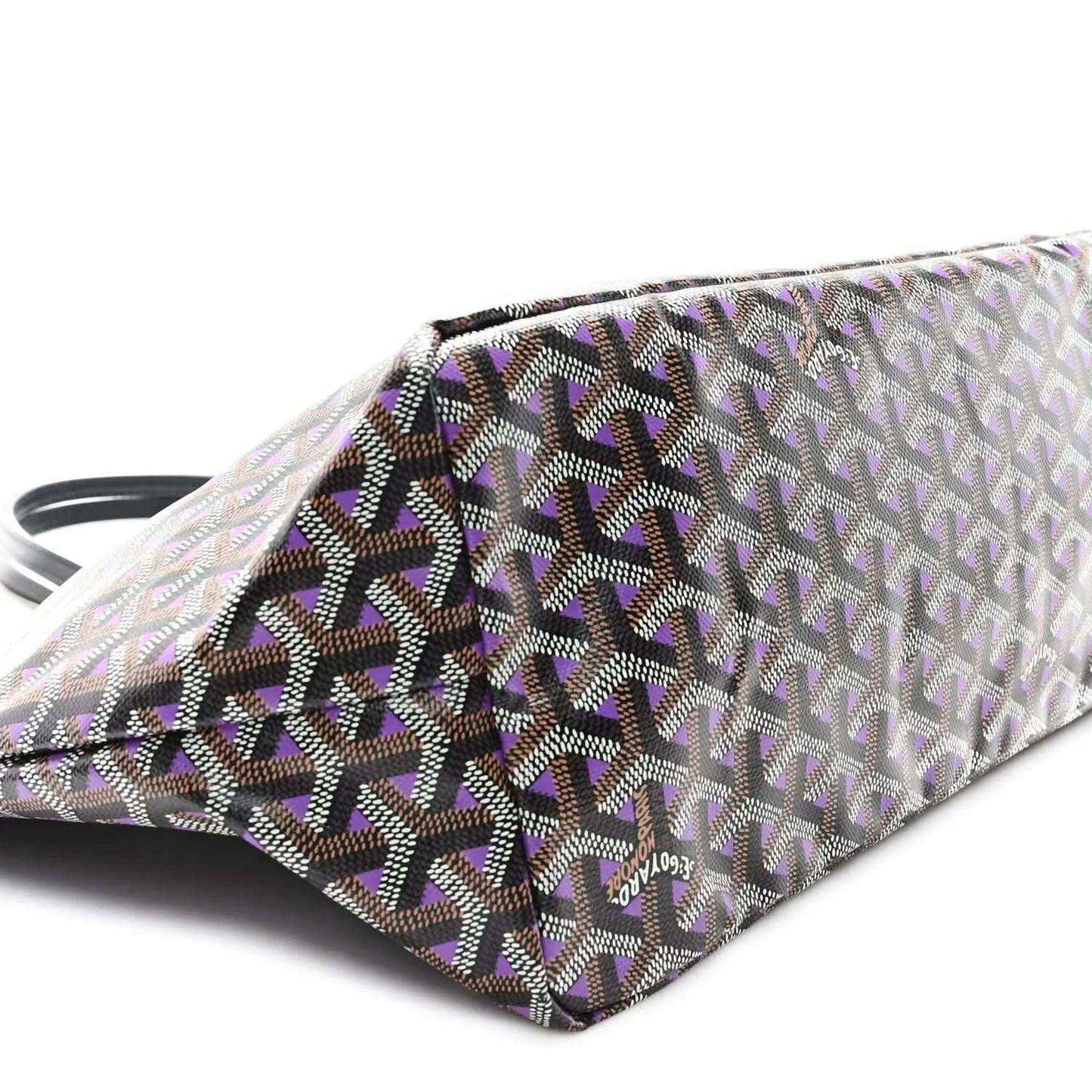 Tote bag folded corner view, monogram fabric in light tones with dark and purple accents