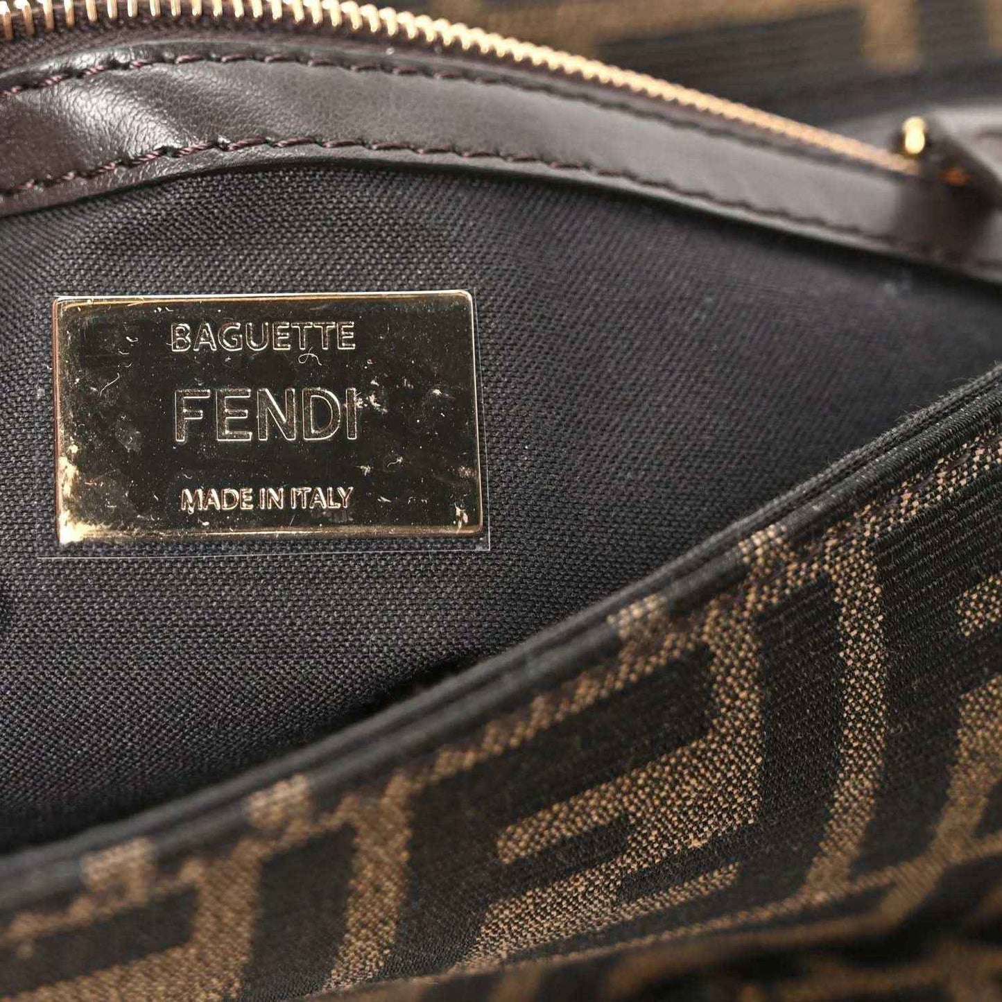 Fendi Baguette label on jacquard fabric, with zipper trim and stitched edge