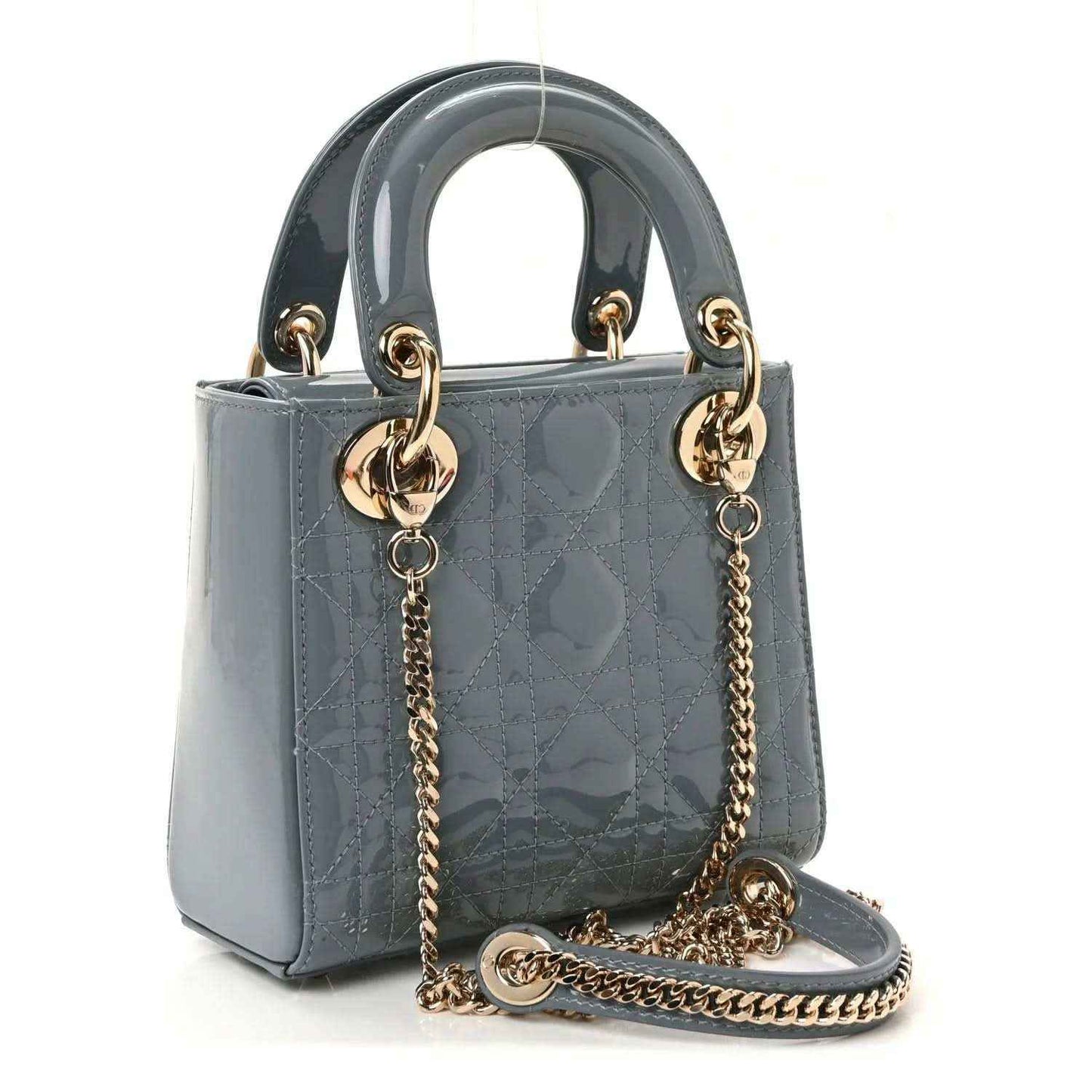 Light blue mini Lady Dior bag with top handles, chain shoulder strap, and front rings